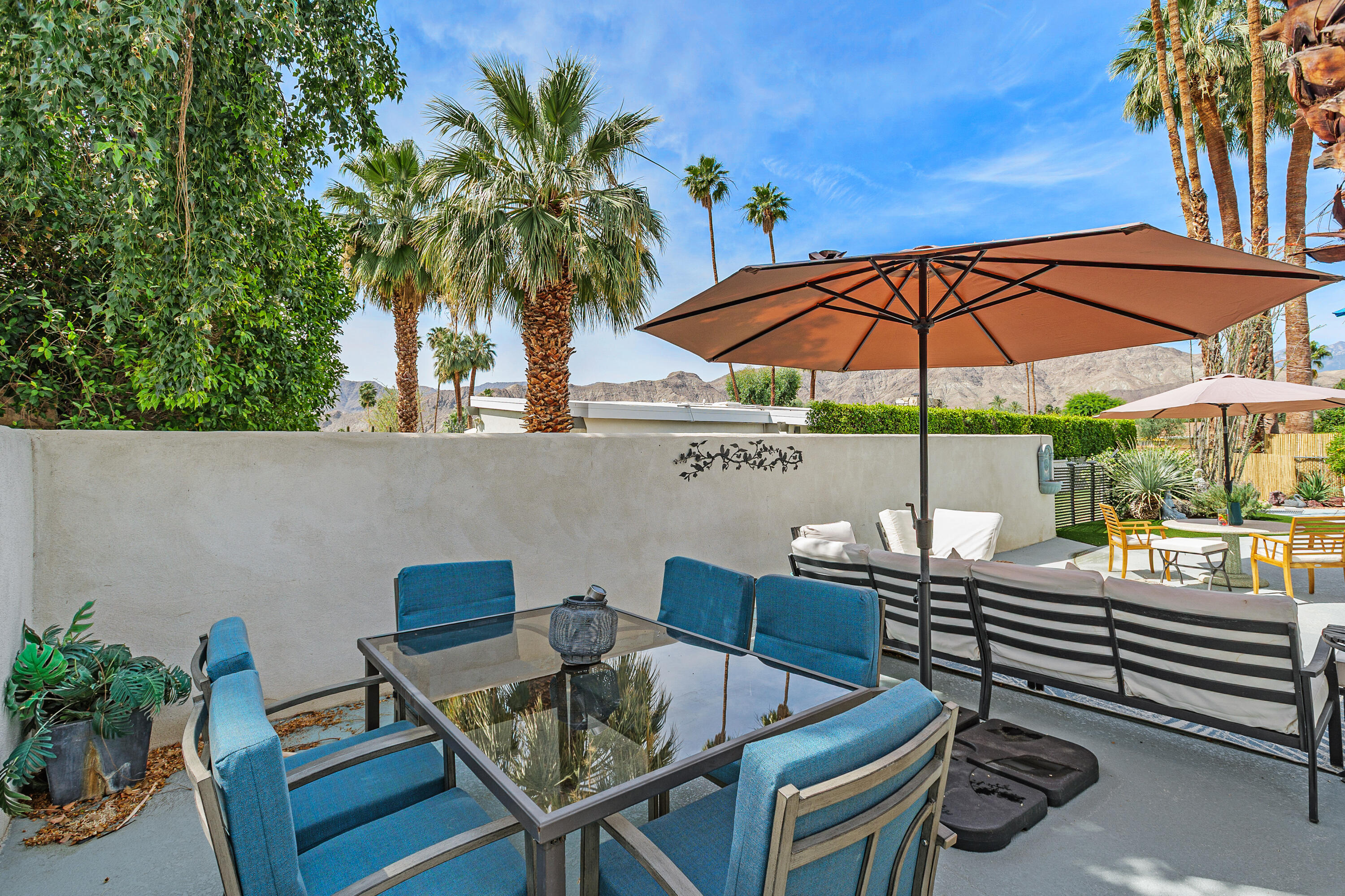 71305 Kempton Avenue Rancho Mirage, CA 92270 - Photo 44 of 58 a view of an outdoor sitting area with chairs