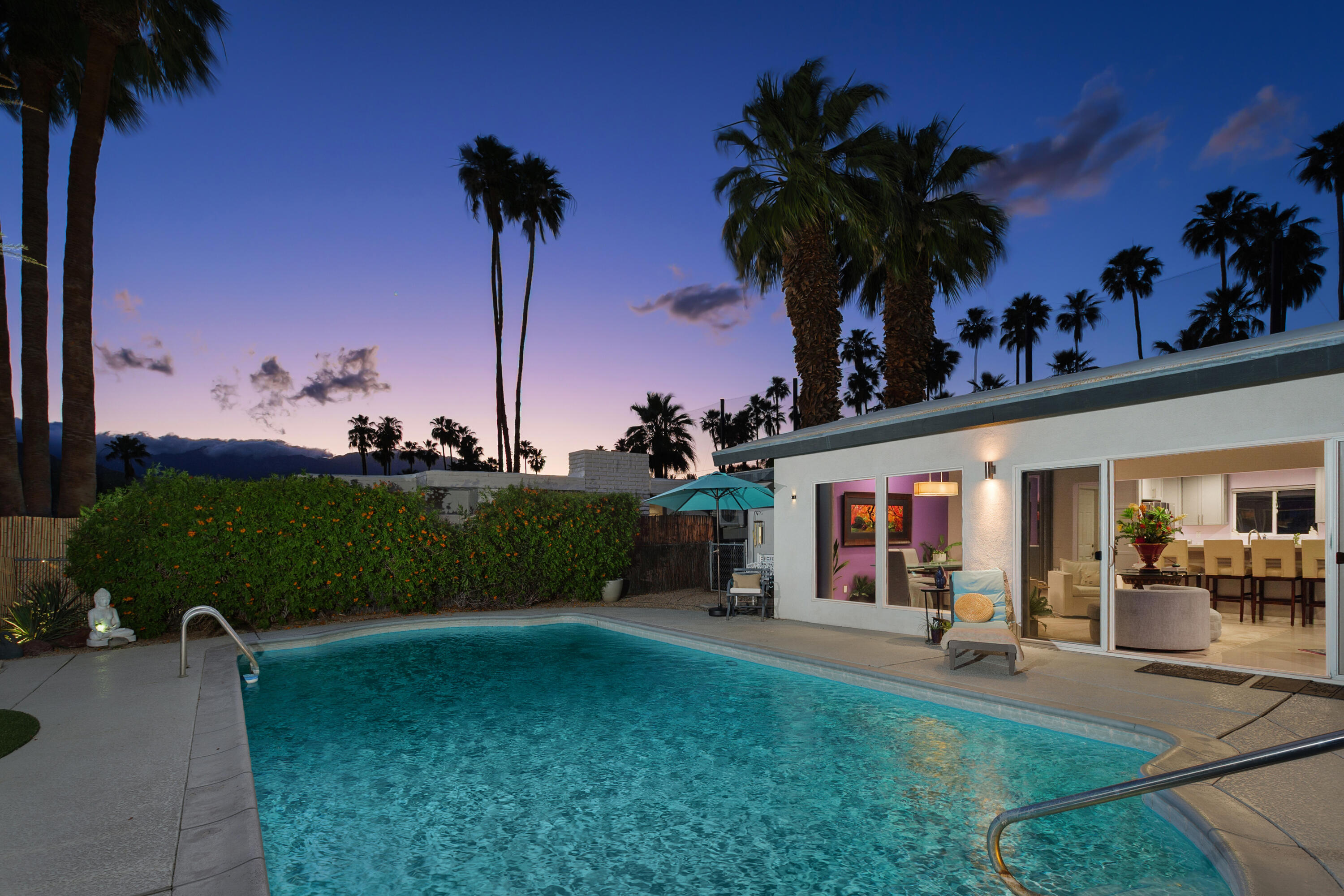 71305 Kempton Avenue Rancho Mirage, CA 92270 - Photo 48 of 58 front view of a house with a yard and potted plants