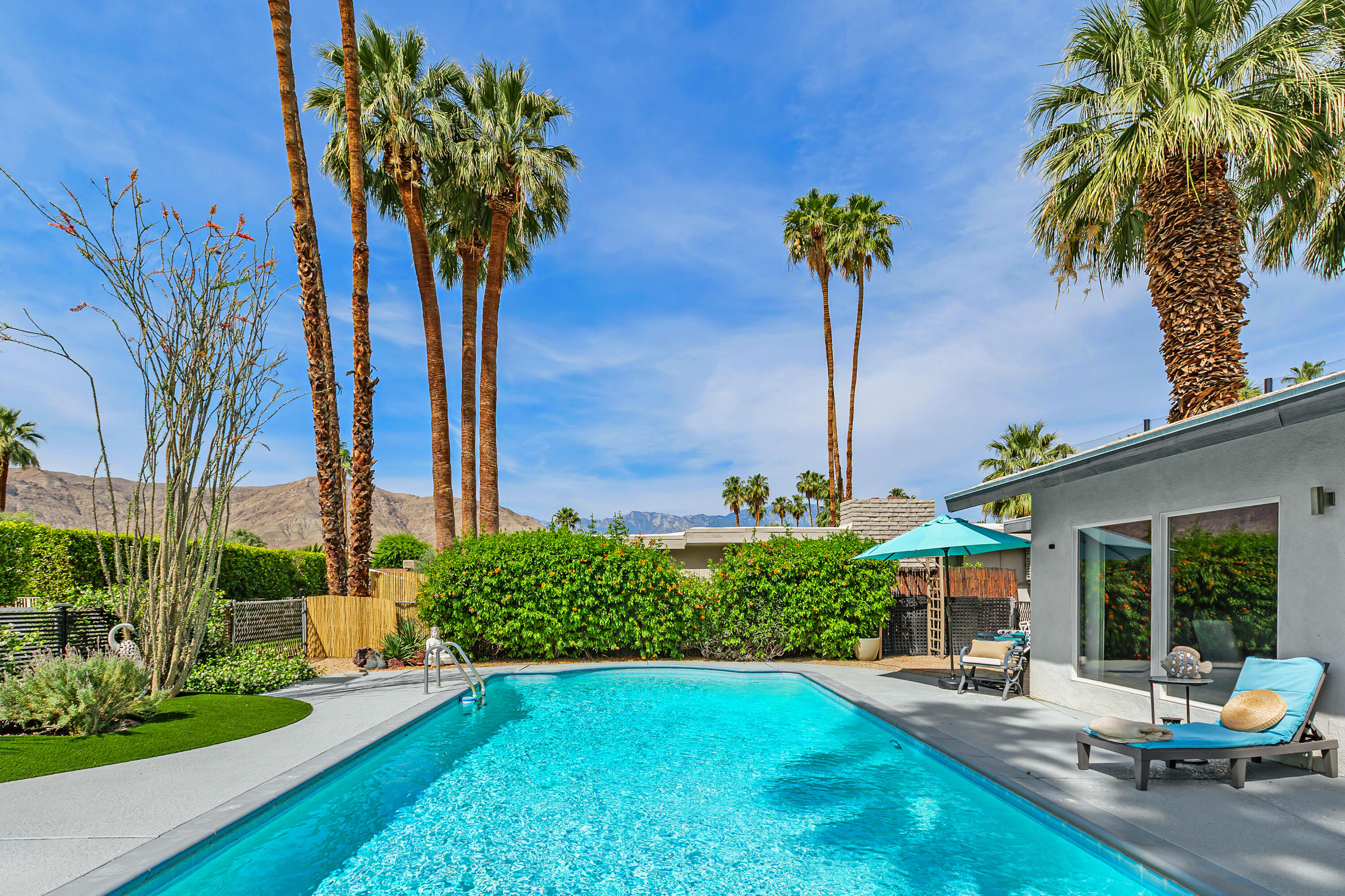 71305 Kempton Avenue Rancho Mirage, CA 92270 - Photo 6 of 58 a front view of a house with garden