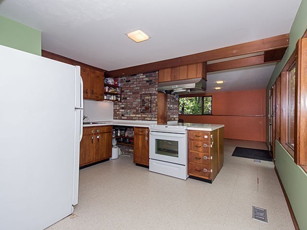 138 Weston Road Lincoln, MA 01773 - Photo 11 of 22 a kitchen with stainless steel appliances a stove and a refrigerator