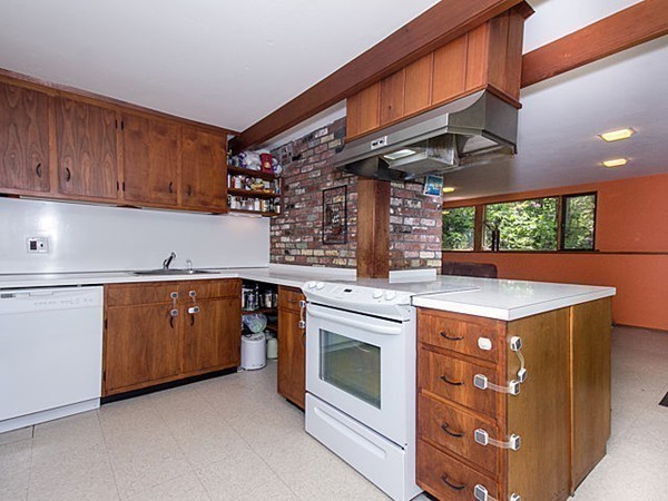 138 Weston Road Lincoln, MA 01773 - Photo 12 of 22 a kitchen with stainless steel appliances granite countertop a stove a sink and a microwave