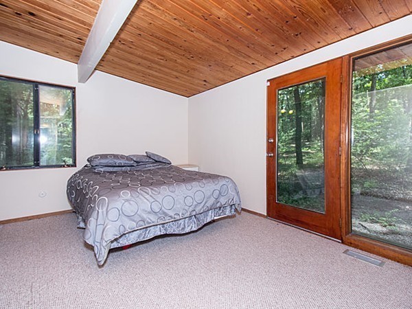 138 Weston Road Lincoln, MA 01773 - Photo 18 of 22 a bedroom with a bed and window