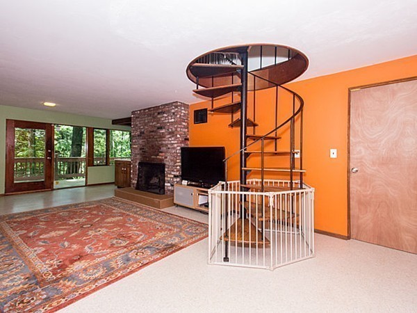 138 Weston Road Lincoln, MA 01773 - Photo 8 of 22 an empty room with windows and fireplace