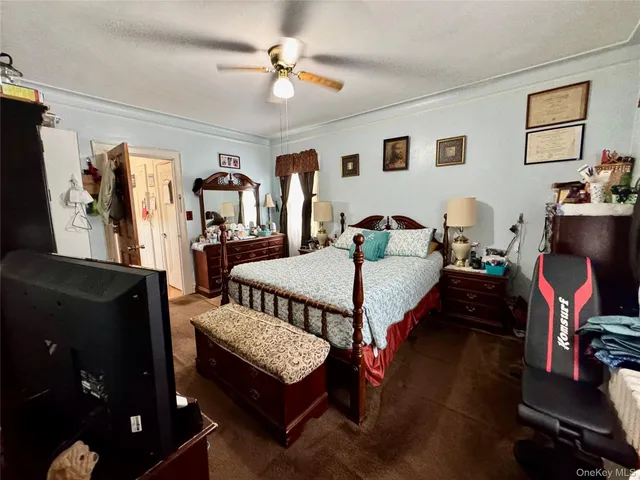 a bedroom with bed and wooden floor