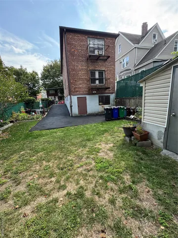 a view of a house with backyard porch and sitting area
