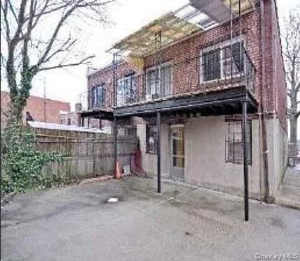 96-28 41st Avenue Queens, NY 11368 - Photo 2 of 5 Rear view of property with a patio and a balcony