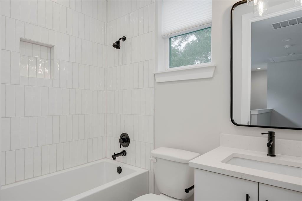 1406 East 2nd Street, Unit 2 Austin, TX 78702 - Photo 14 of 20 a bathroom with a sink a toilet and bathtub