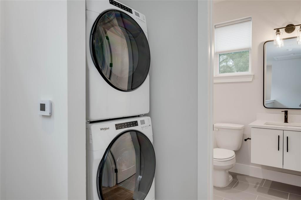 1406 East 2nd Street, Unit 2 Austin, TX 78702 - Photo 15 of 20 a bathroom with a toilet mirror and vanity