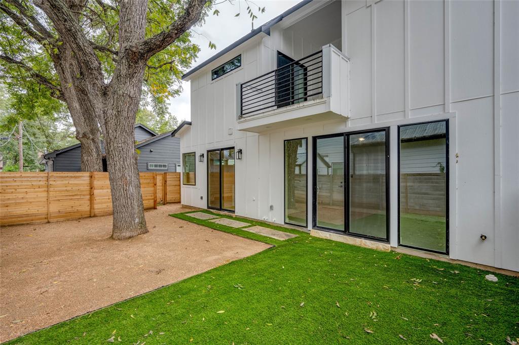 1406 East 2nd Street, Unit 2 Austin, TX 78702 - Photo 17 of 20 a view of a house with backyard and a tree