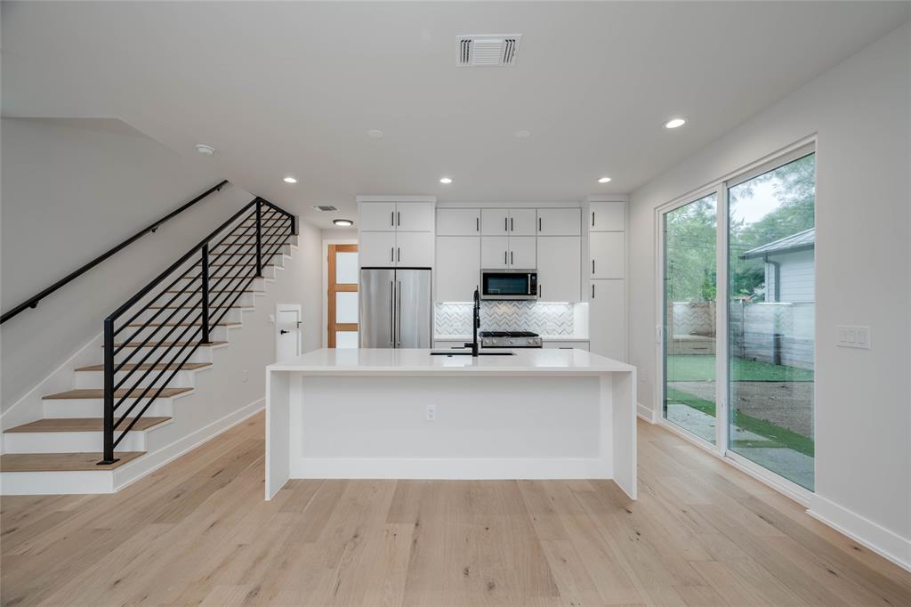 1406 East 2nd Street, Unit 2 Austin, TX 78702 - Photo 3 of 20 a view of kitchen with sink microwave and stove