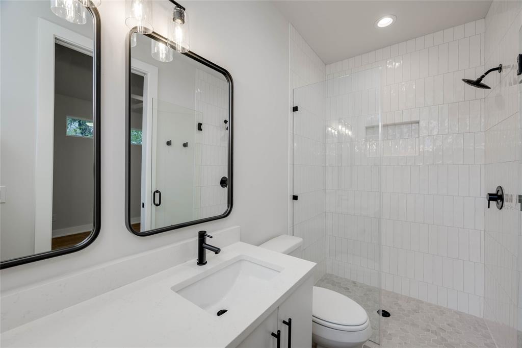 1406 East 2nd Street, Unit 2 Austin, TX 78702 - Photo 5 of 20 a bathroom with a sink toilet and shower