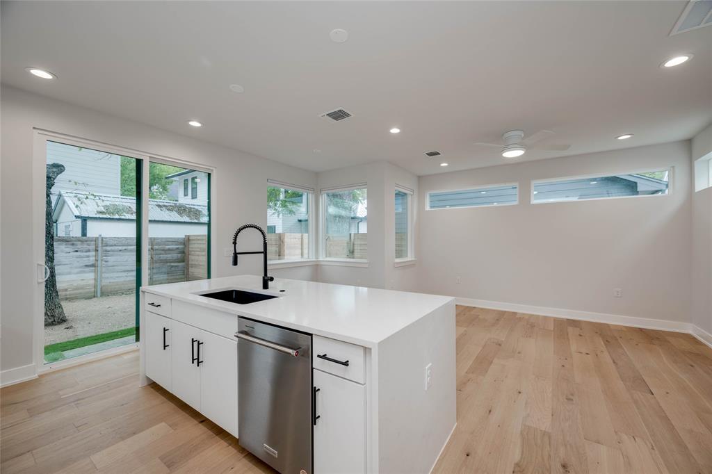 1406 East 2nd Street, Unit 2 Austin, TX 78702 - Photo 8 of 20 a kitchen with a sink and wooden floor