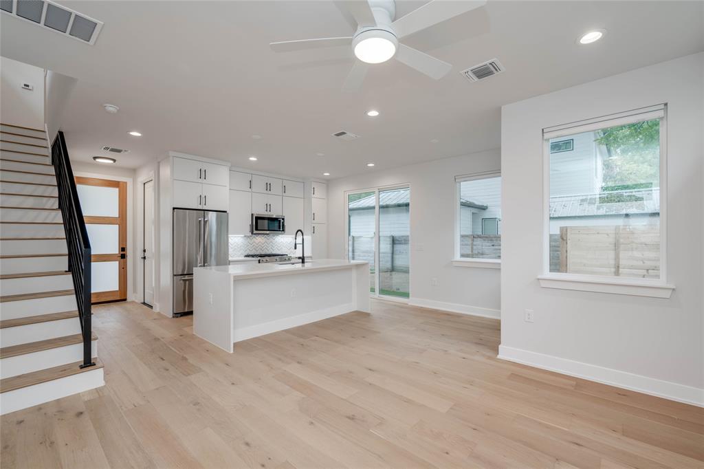 1406 East 2nd Street, Unit 2 Austin, TX 78702 - Photo 9 of 20 a view of kitchen with stainless steel appliances refrigerator oven and cabinets