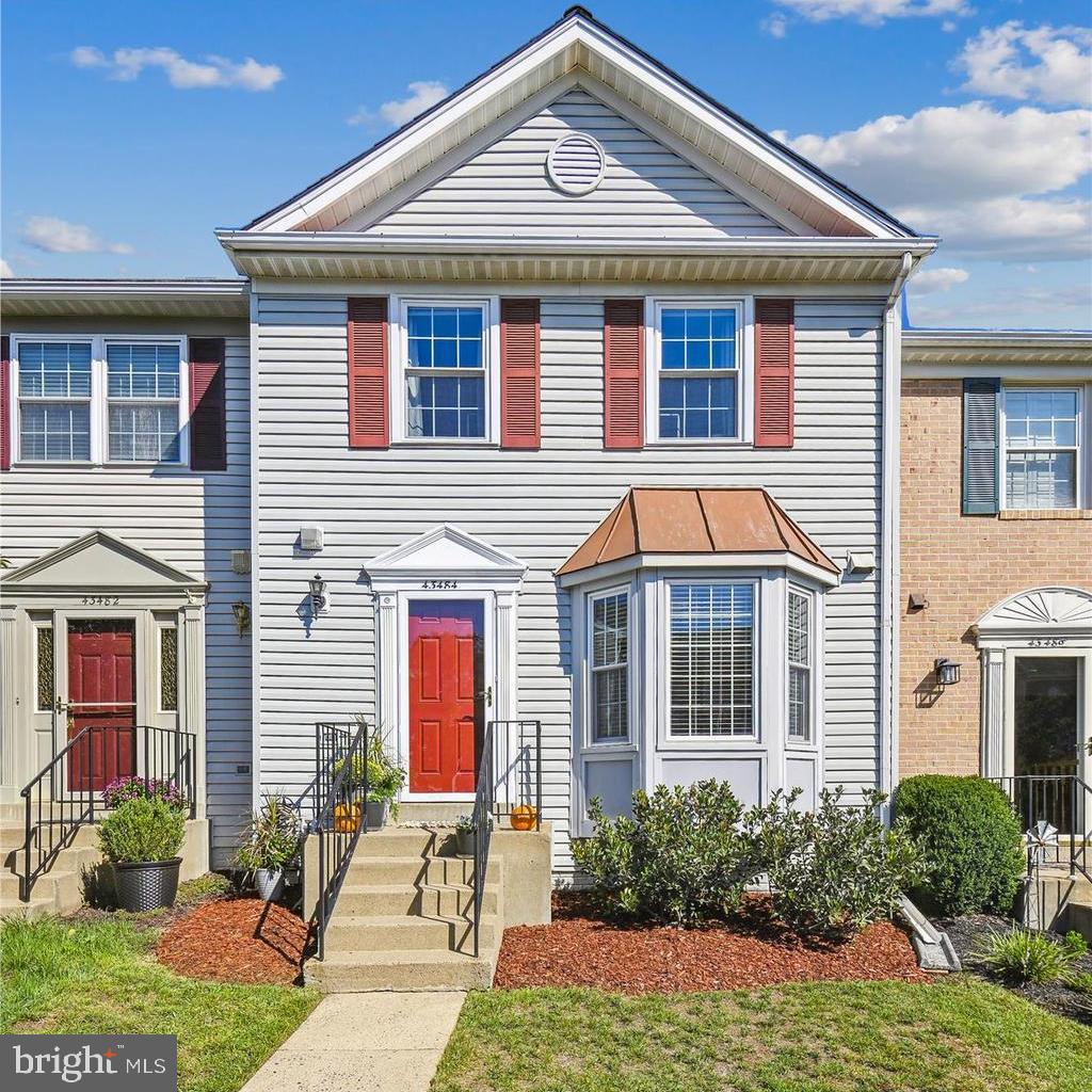 43484 Blacksmith Square Ashburn, VA 20147 - Photo 1 of 53 a front view of a house with garden