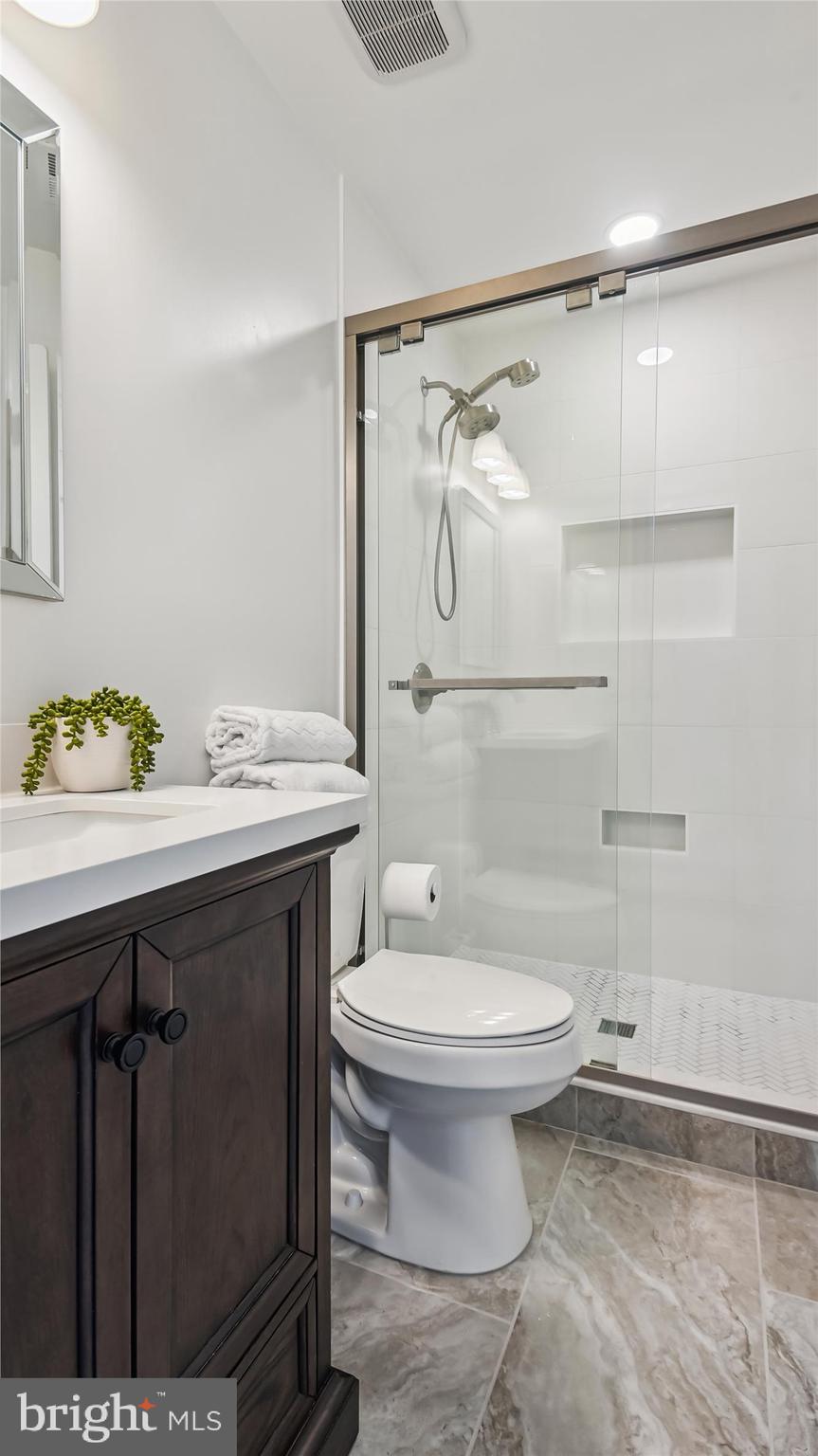 43484 Blacksmith Square Ashburn, VA 20147 - Photo 16 of 53 Primary Bath frameless glass shower, modern tile