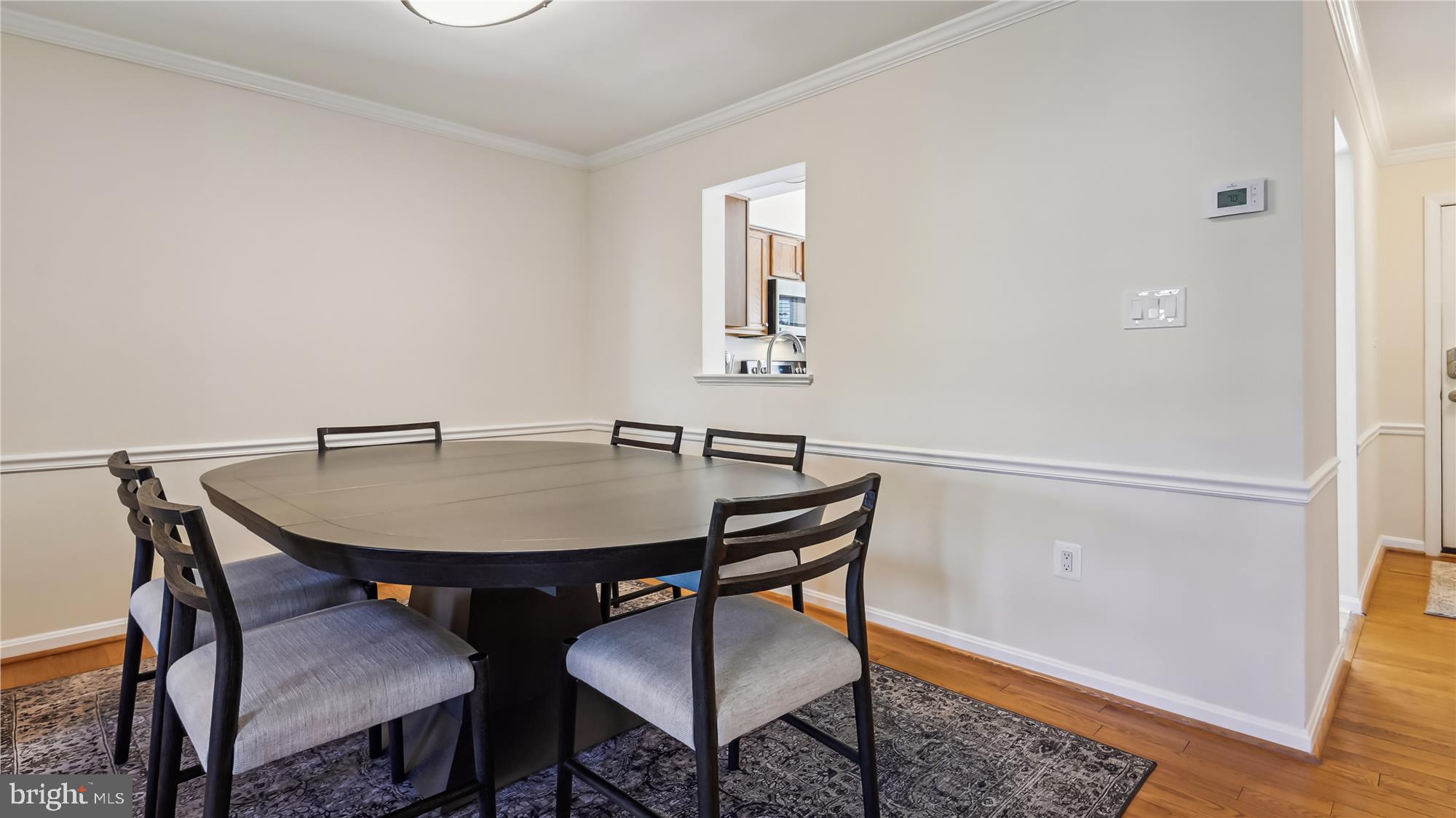 43484 Blacksmith Square Ashburn, VA 20147 - Photo 8 of 53 Dining Room pass through window to kitchen