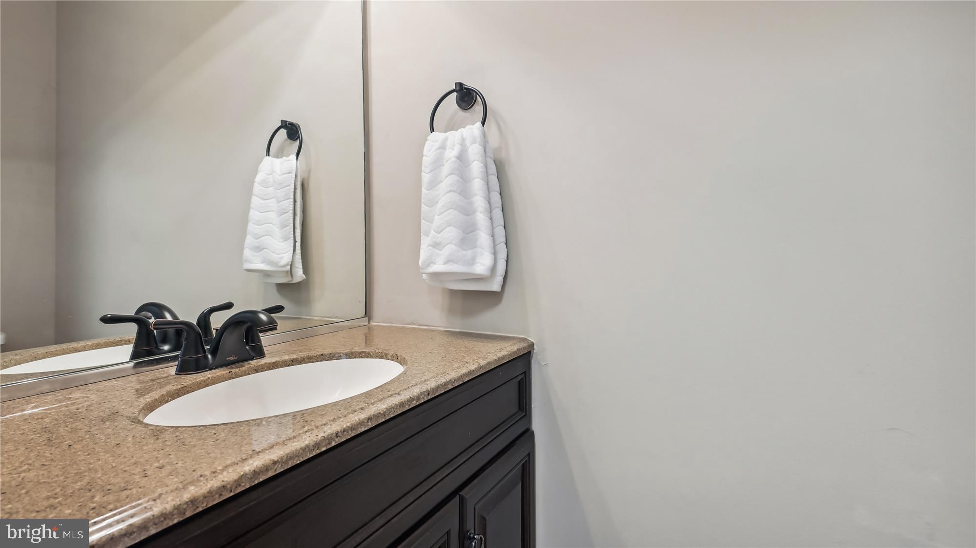 43484 Blacksmith Square Ashburn, VA 20147 - Photo 9 of 53 Powder Room Main level granite counter wood floor