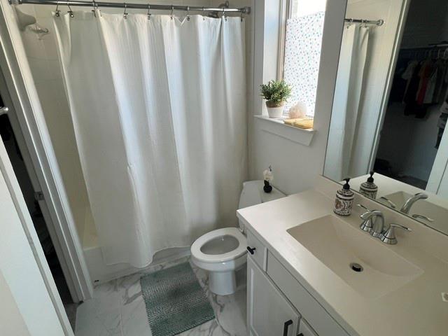 1407 Cartona Road Fate, TX 75087 - Photo 6 of 30 Bathroom featuring a vanity with an integrated sink, polished chrome faucet, and a large mirror