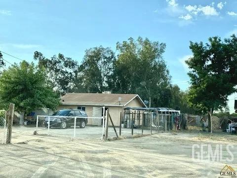 Undisclosed Address Earlimart, CA 93219 - Photo 2 of 4 a view of a house with a swimming pool