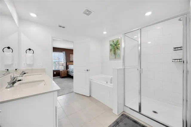 a view of walk in closet with clothes