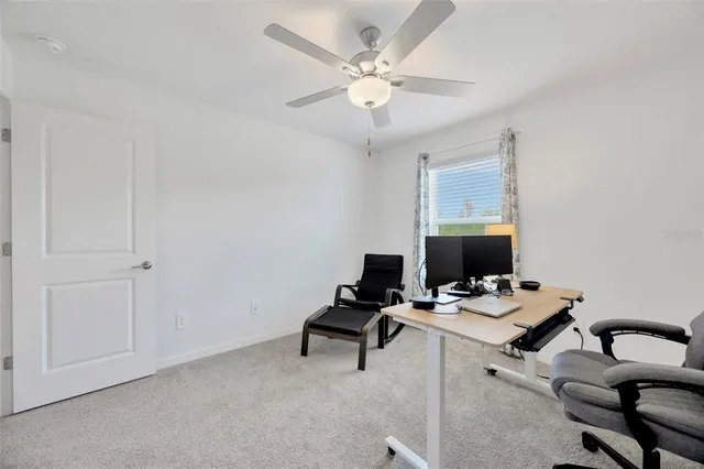 a view of a workspace with furniture