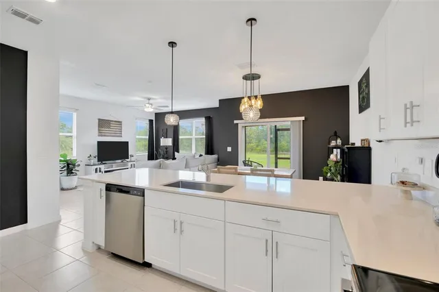 a kitchen with sink and microwave
