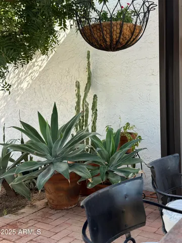 a view of swimming pool with outdoor seating