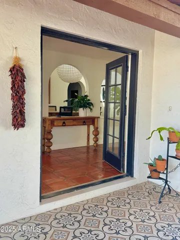 a outdoor space with lots of tables a garden view and chairs