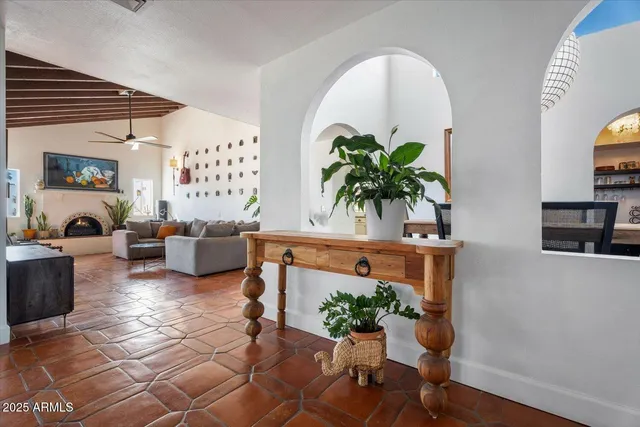 a view of livingroom with furniture and a potted plant