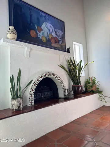 a view of living room with furniture and a potted plant