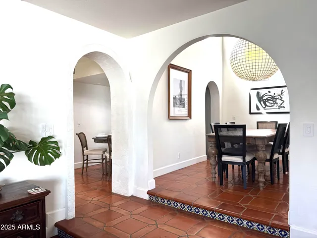 a living room with furniture fireplace and a couch