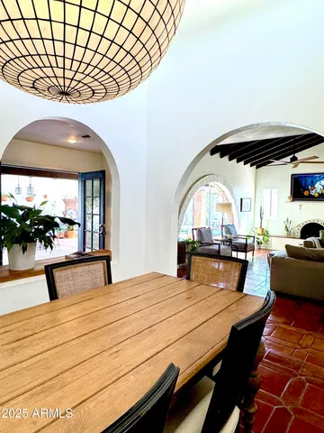 a dining room with furniture and window
