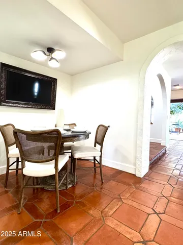 a view of a chairs and table in the patio