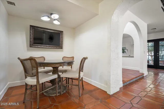 a view of a dining room with furniture and a rug