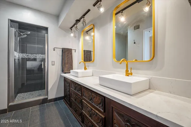 a bedroom with a dresser and a window