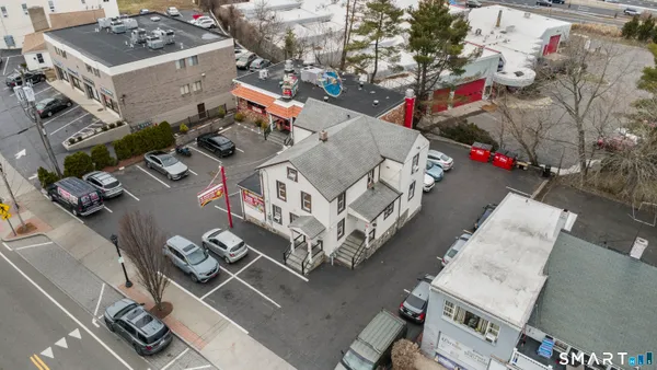 an aerial view of multiple houses with outdoor space