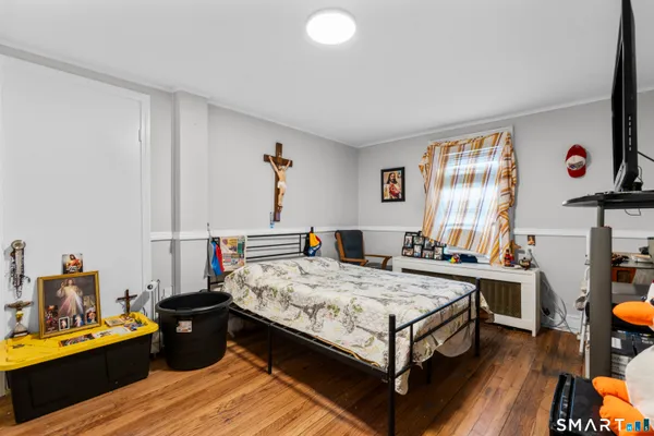 a bed room with a bed and a window