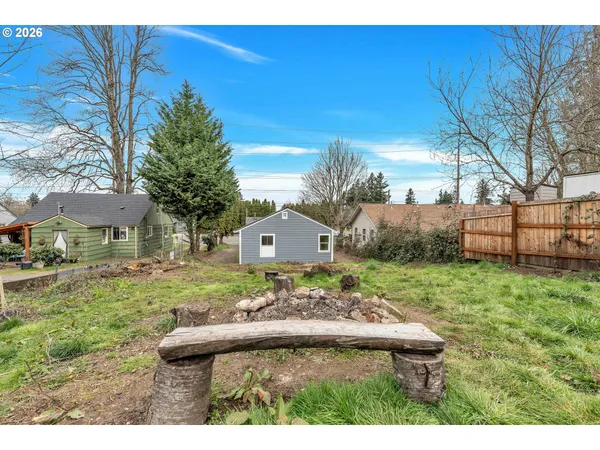 a view of a backyard with a garden and plants