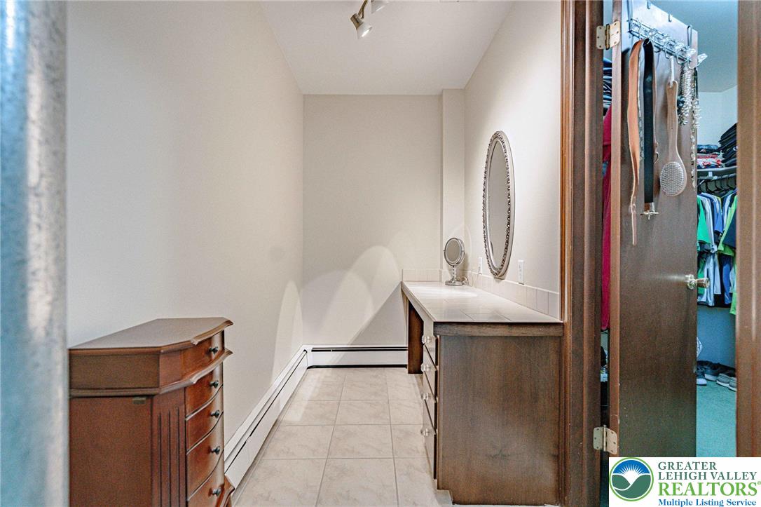 3857 Friedens Road Slatington, PA 18080 - Photo 40 of 75 This spacious walk-in closet features ample storage and a dedicated vanity area for daily routines.