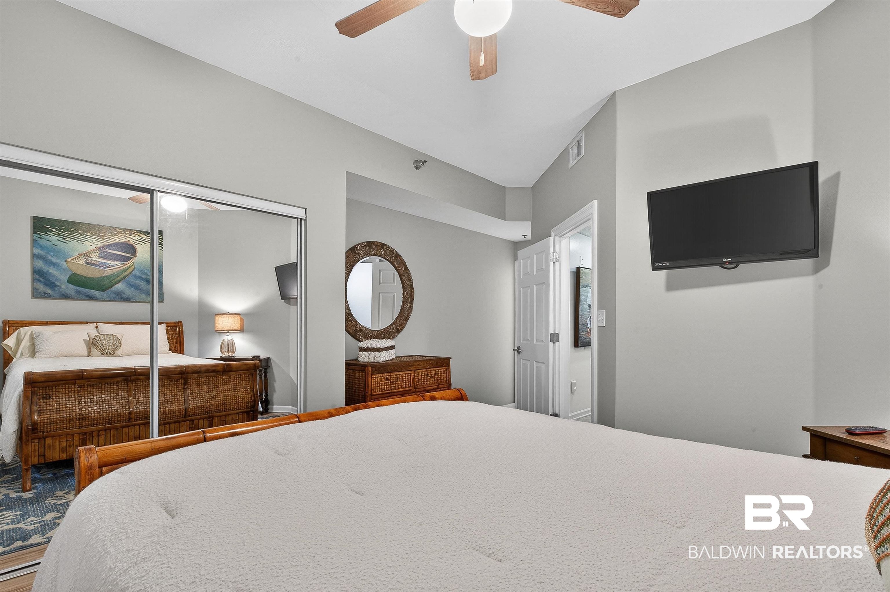 27282 Canal Road, Unit 408 Orange Beach, AL 36561 - Photo 15 of 37 Bedroom with ceiling fan and a closet