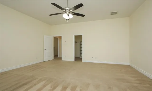 an empty room with fan