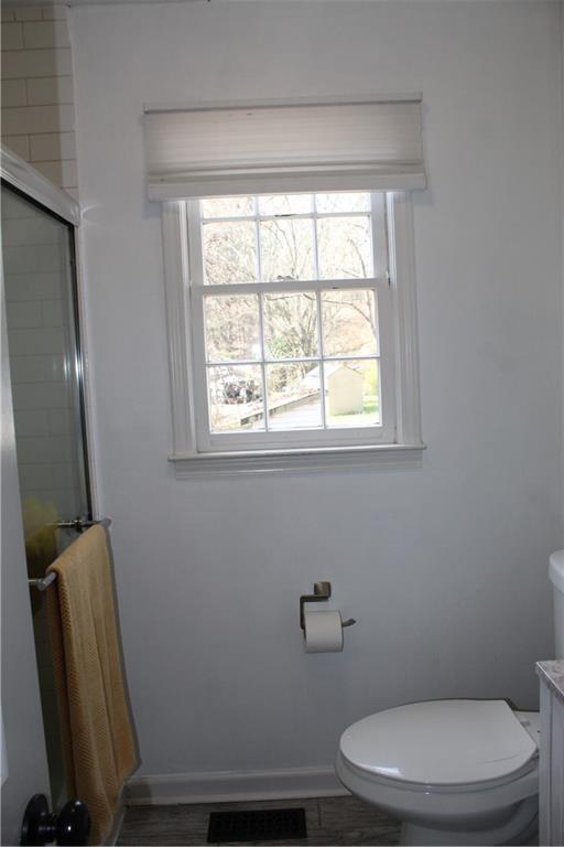 40 Chestatee Springs Road Dahlonega, GA 30533 - Photo 14 of 43 a white toilet sitting next to a window