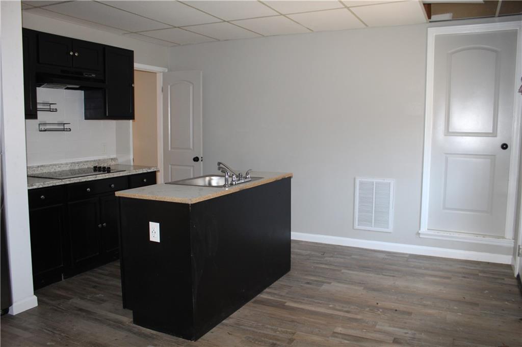 40 Chestatee Springs Road Dahlonega, GA 30533 - Photo 19 of 43 a kitchen with a sink and cabinets