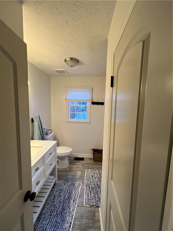 40 Chestatee Springs Road Dahlonega, GA 30533 - Photo 19 of 42 a bathroom with a bathtub and a toilet