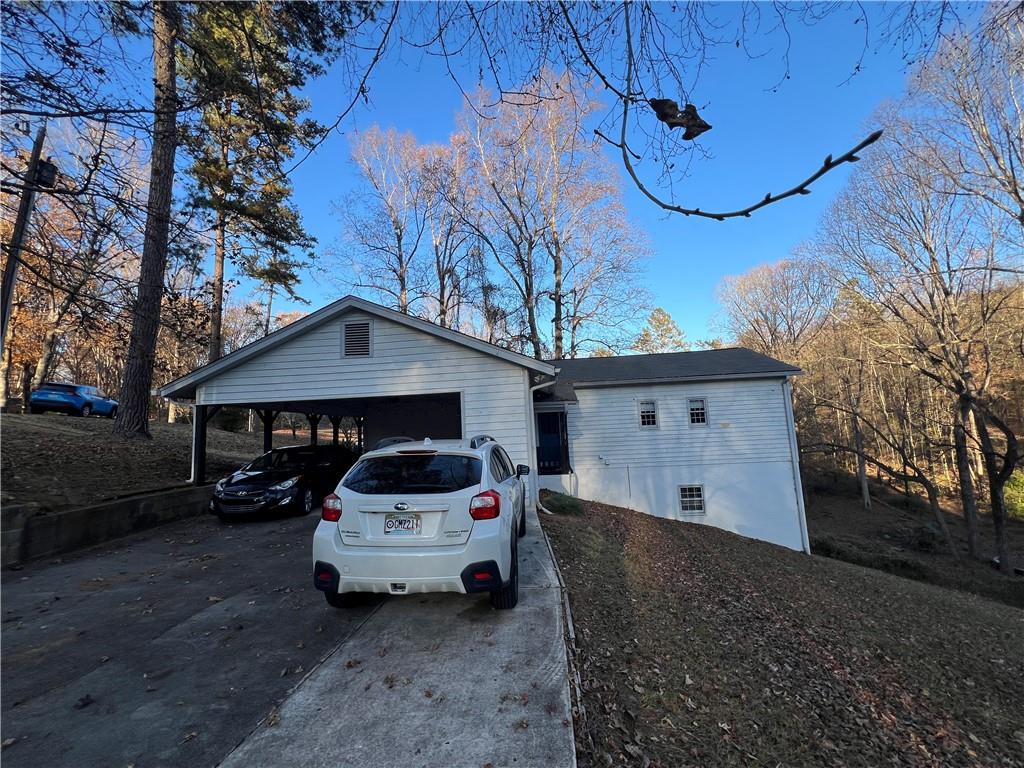 40 Chestatee Springs Road Dahlonega, GA 30533 - Photo 2 of 42 a car parked in front of white house