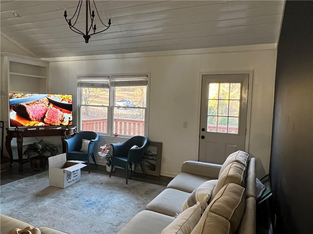 40 Chestatee Springs Road Dahlonega, GA 30533 - Photo 21 of 42 a living room with furniture a window and a flat screen tv