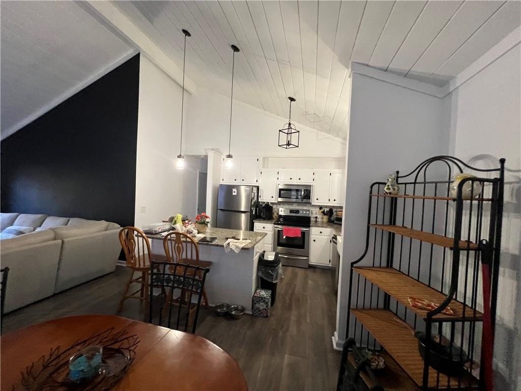 40 Chestatee Springs Road Dahlonega, GA 30533 - Photo 27 of 42 a living room with furniture a fireplace and a flat screen tv