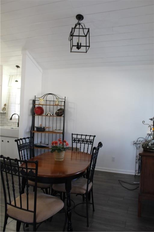 40 Chestatee Springs Road Dahlonega, GA 30533 - Photo 29 of 43 a view of a dining room with furniture and wooden floor