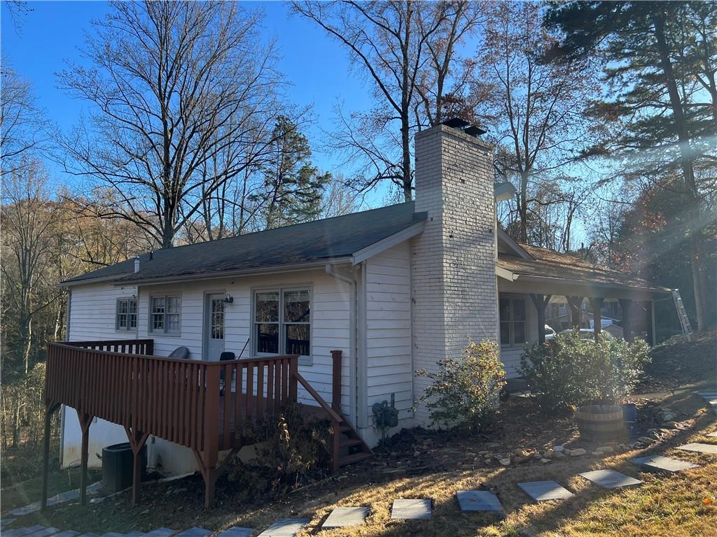 40 Chestatee Springs Road Dahlonega, GA 30533 - Photo 35 of 42 a view of house with a yard and furniture
