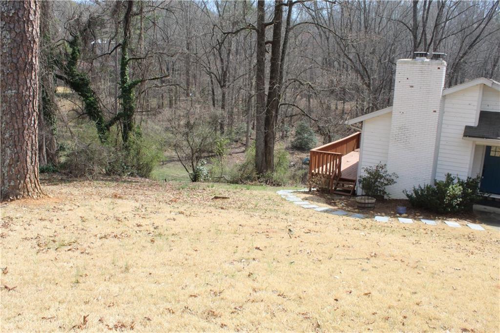 40 Chestatee Springs Road Dahlonega, GA 30533 - Photo 38 of 43 a backyard of a house with large trees